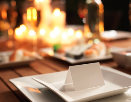 table setting with place card and candles