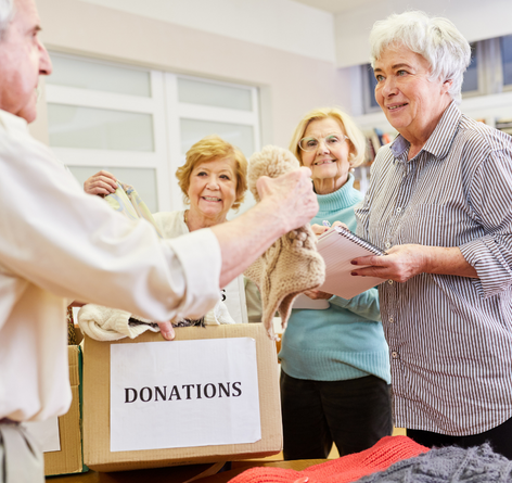 group of seniors donating items in boxes together
