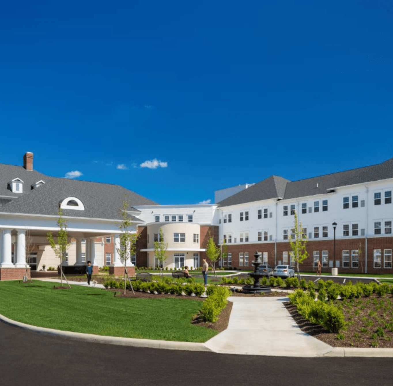 Exterior of Wesley Woods community with landscaping and fountain