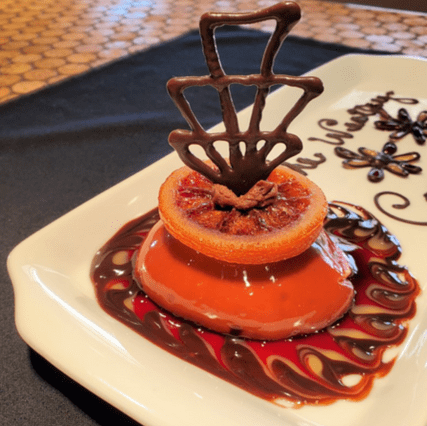Upscale orange fruit dessert made by Wesley Woods chef
